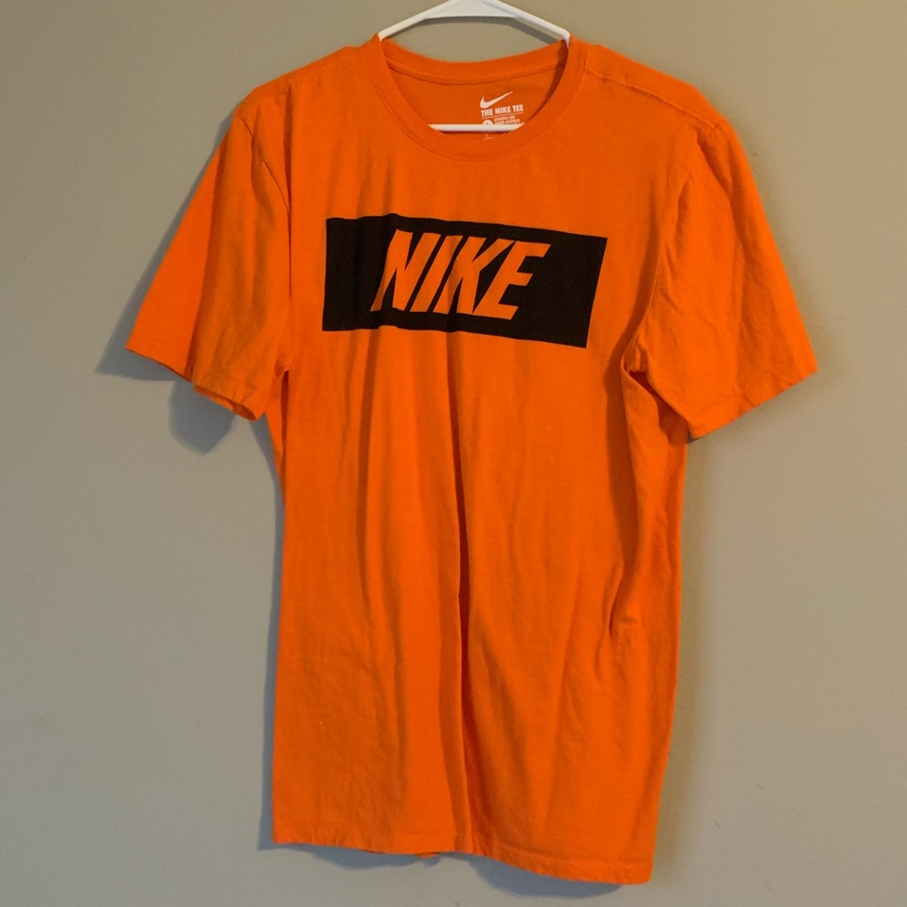 orange Nike shirt